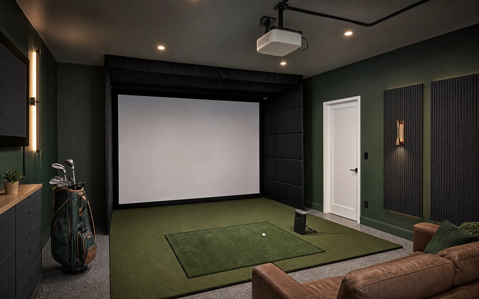 Representative home golf simulator room with impact screen, hitting mat, projector and launch monitor